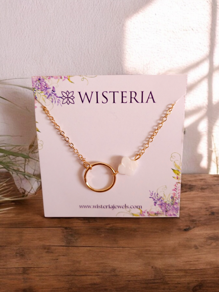 Chain Bracelet with Circular and Clover Pendants	