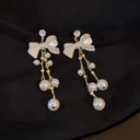 Delicate Pearl Bow-Shaped Tassel Earrings